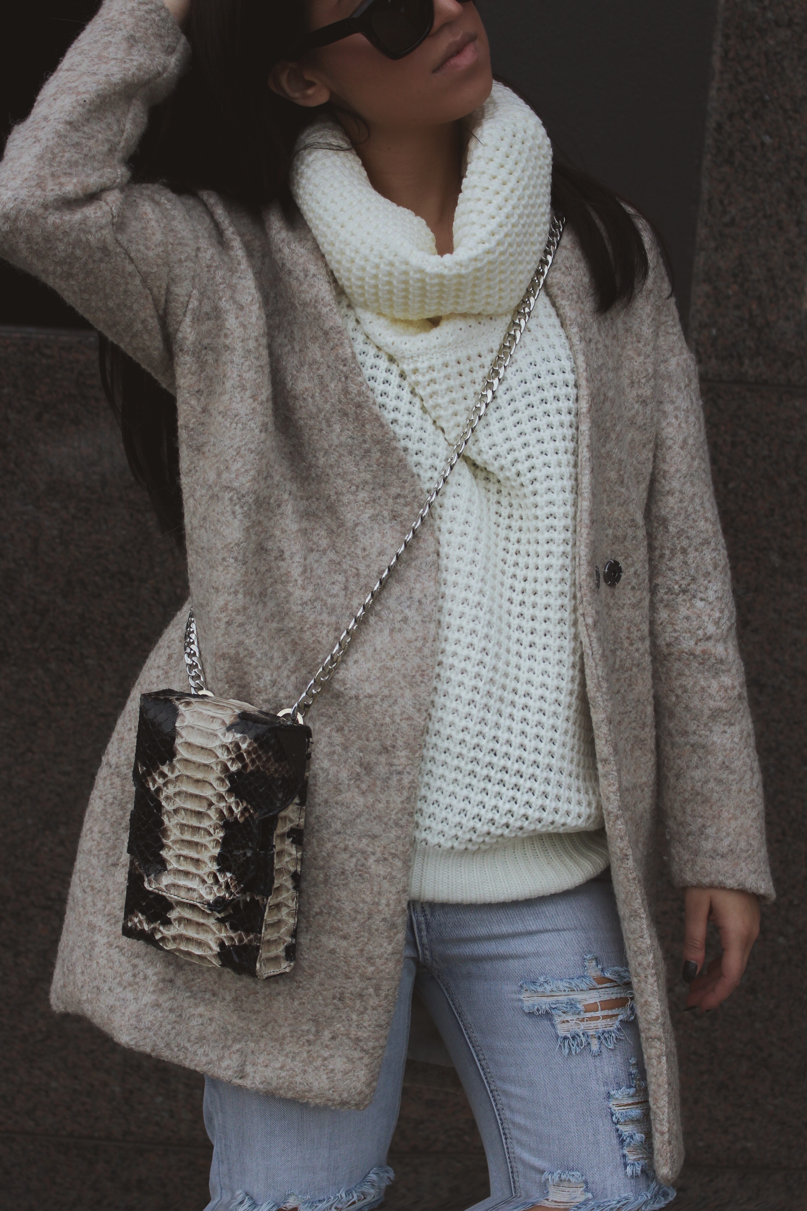 LA blogger Tania Sarin with turtleneck knit and snakeskin crossbody