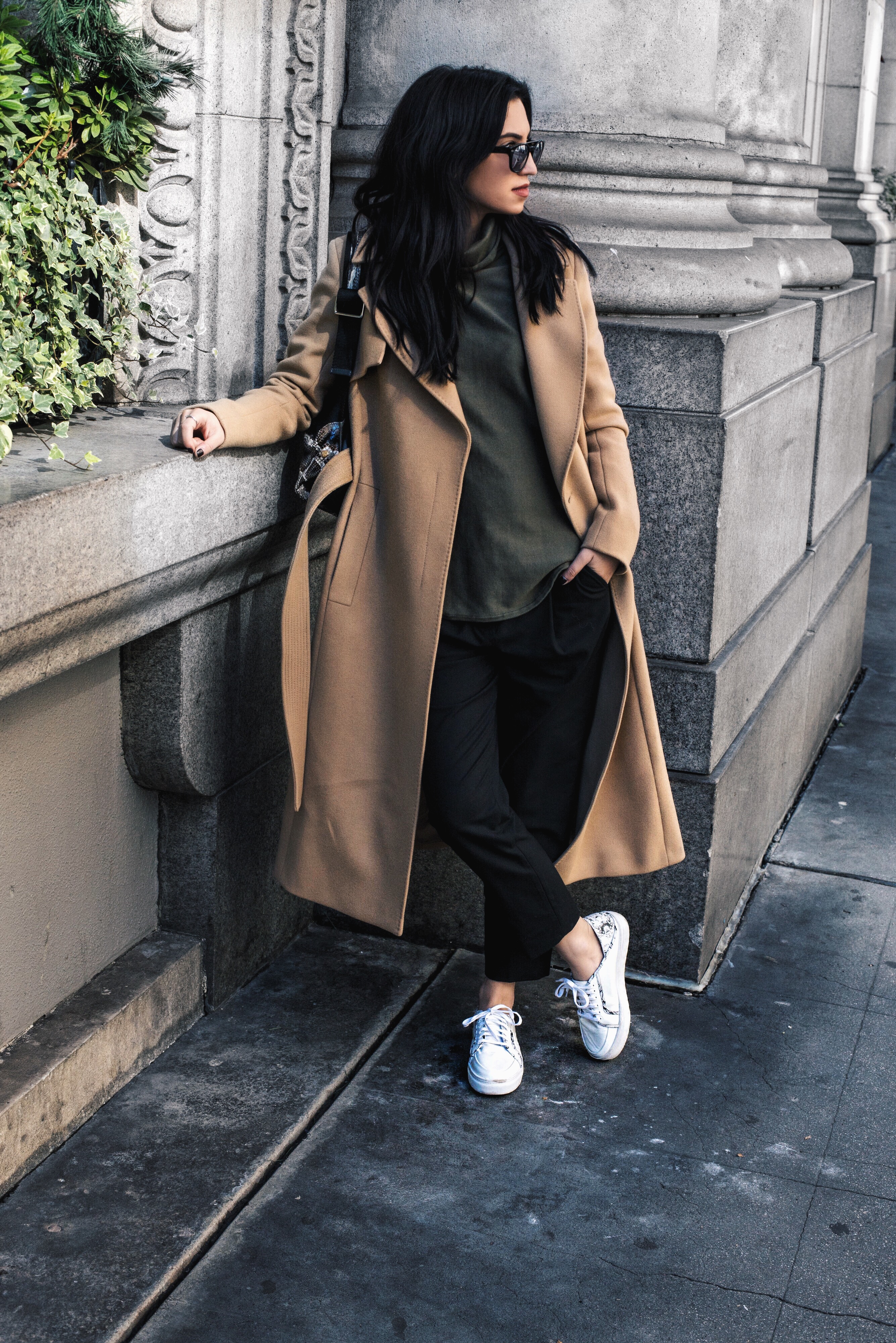 LA blogger Tania Sarin wearing long camel coat and sneakers