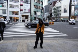 LA blogger Tania Sarin traveling in tokyo in yellow moto jacket and stella shoes