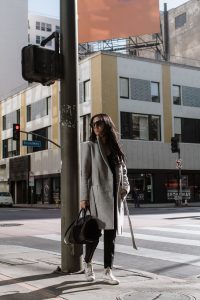 LA Blogger Tania Sarin in high top converse and givenchy bag