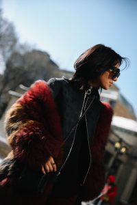 LA Blogger Tania Sarin in New York during NYFW in red fur coat and chanel crossbody