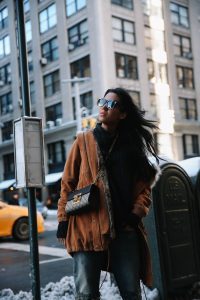 LA Blogger Tania Sarin in New York during NYFW in celine sunglasses and gucci padlock crossbody