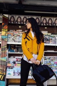 LA Blogger Tania Sarin in yellow moto jacket and givenchy bag