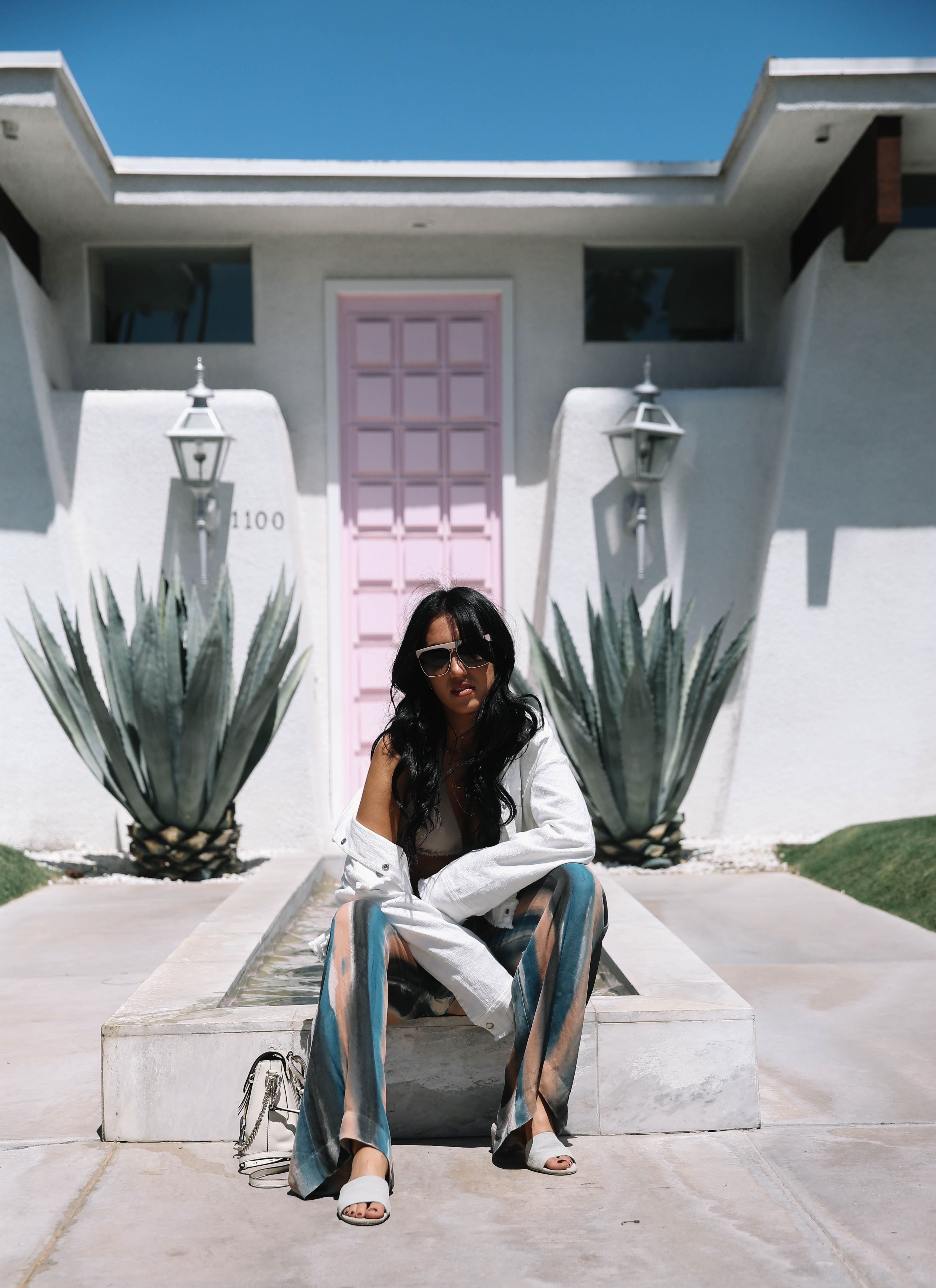 LA Blogger Tania Sarin on coachella weekend featuring festival style with raquel allegra pant and chloe mini backpack