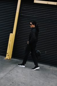 LA Blogger Tania Sarin out in LA wearing Phillip Lim jacket, balenciaga speed sneaker and givenchy bag in an all black look.
