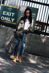 LA Blogger Tania Sarin in camo jacket, timberland boots, goyard tote