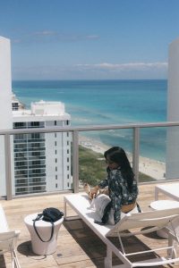 LA Blogger Tania Sarin at Miami W hotel in Chloe top and Elizabeth James pant. beach view