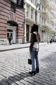 LA Blogger tania Sarin in New York City Soho wearing Laer cropped leather jacket with enfold top, redone denim, dear frances boot, and chanel cross body bag