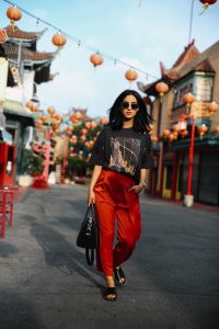 LA Blogger Tania Sarin in China town wearing red pant and vintage tee shooting editorial style