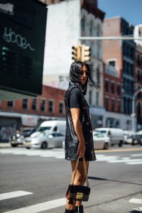 LA Blogger Tania Sarin in New York City wearing each x other long leather vest with gucci bag and dear frances boot