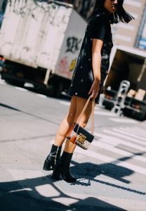LA Blogger Tania Sarin in New York City wearing each x other long leather vest with gucci bag and dear frances boot