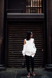 LA Blogger Tania Sarin in NYC wearing enfold cold shoulder top and prada booties