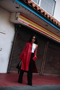 LA Blogger Tania Sarin in China town wearing red leather coat and givenchy bag shooting editorial style