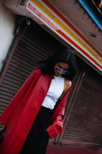 LA Blogger Tania Sarin in China town wearing red leather coat and givenchy bag shooting editorial style