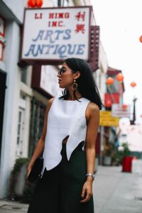 LA Blogger Tania Sarin in China Town wearing asymmetrical top and bold statement earrings