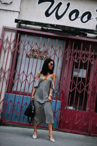 LA Blogger Tania Sarin in chinatown showing wedding season fashion with alexander wang slip silk dress, prada heels, and givenchy bag