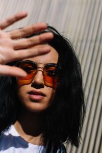 LA Blogger Tania Sarin wearing gigi hadid vogue eyewear sunglasses and striped blazer in