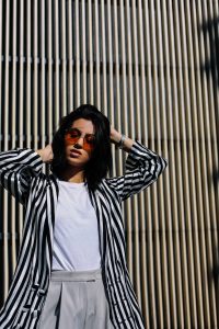 LA Blogger Tania Sarin wearing gigi hadid vogue eyewear sunglasses and striped blazer in