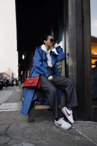 LA Blogger Tania Sarin at new york fashion week wearing MISHBHV jacket, nike cortez and Illesteva sunglasses