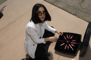 LA blogger Tania Sarin wearing illesteva sunglasses with her Chanel beauty box