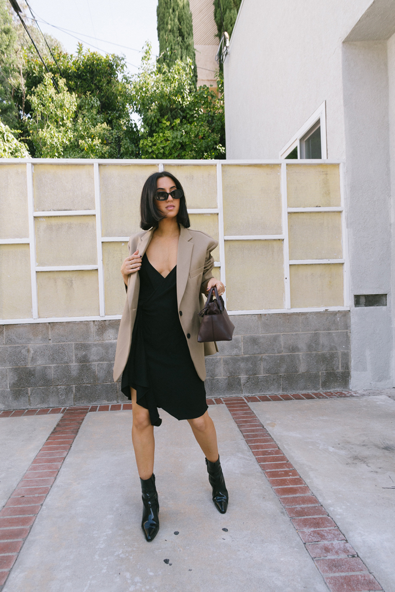 How to Wear a Little Black Dress Casually | TSARIN.COM | Little black dress, oversized blazer, balenciaga boots, carolina santo domingo handbag, minimal edgy outfit