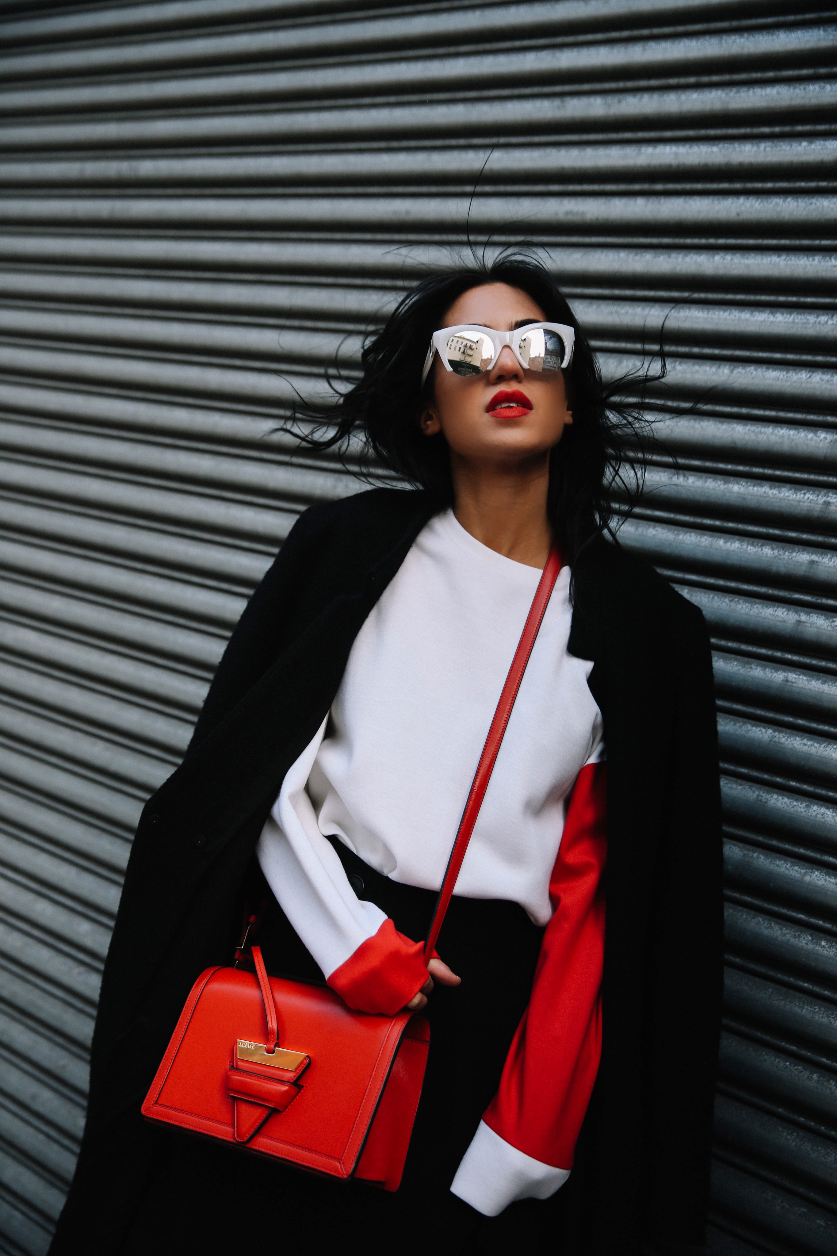 LA Blogger Tania Sarin in New York during NYFW with loewe bag and red lip