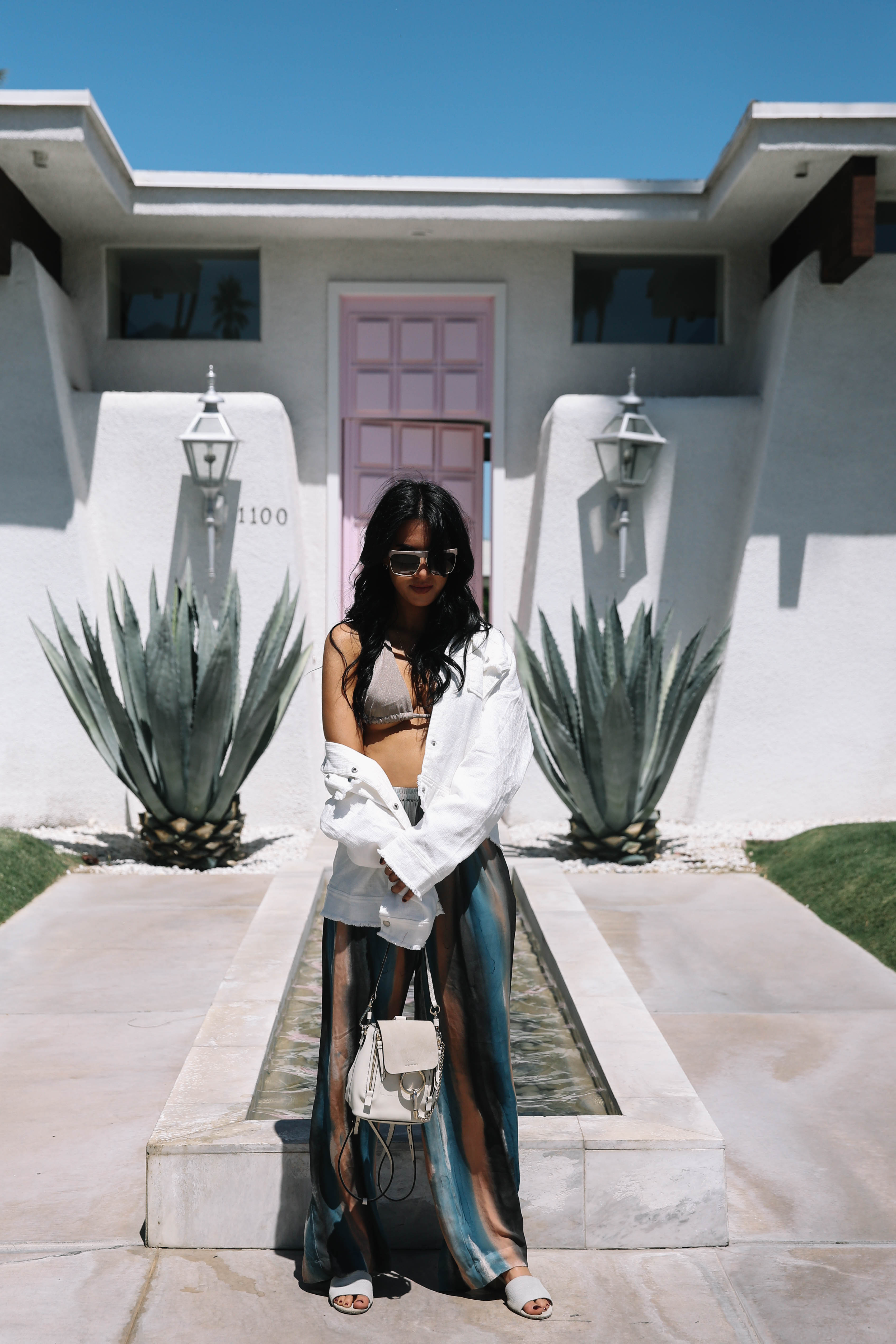 LA Blogger Tania Sarin on coachella weekend featuring festival style with raquel allegra pant and chloe mini backpack