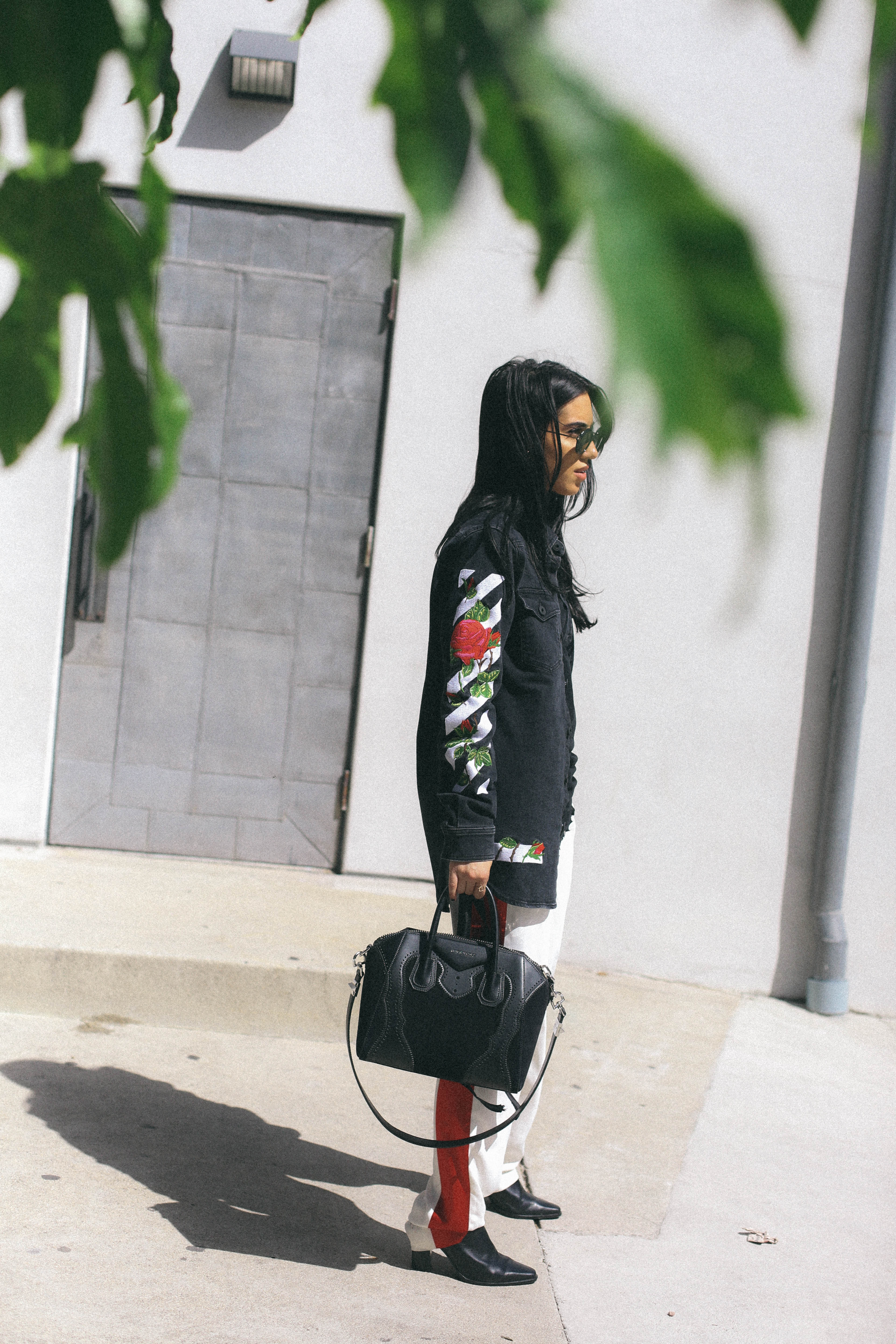 LA Blogger Tania Sarin in offwhite denim jacket and givenchy bag
