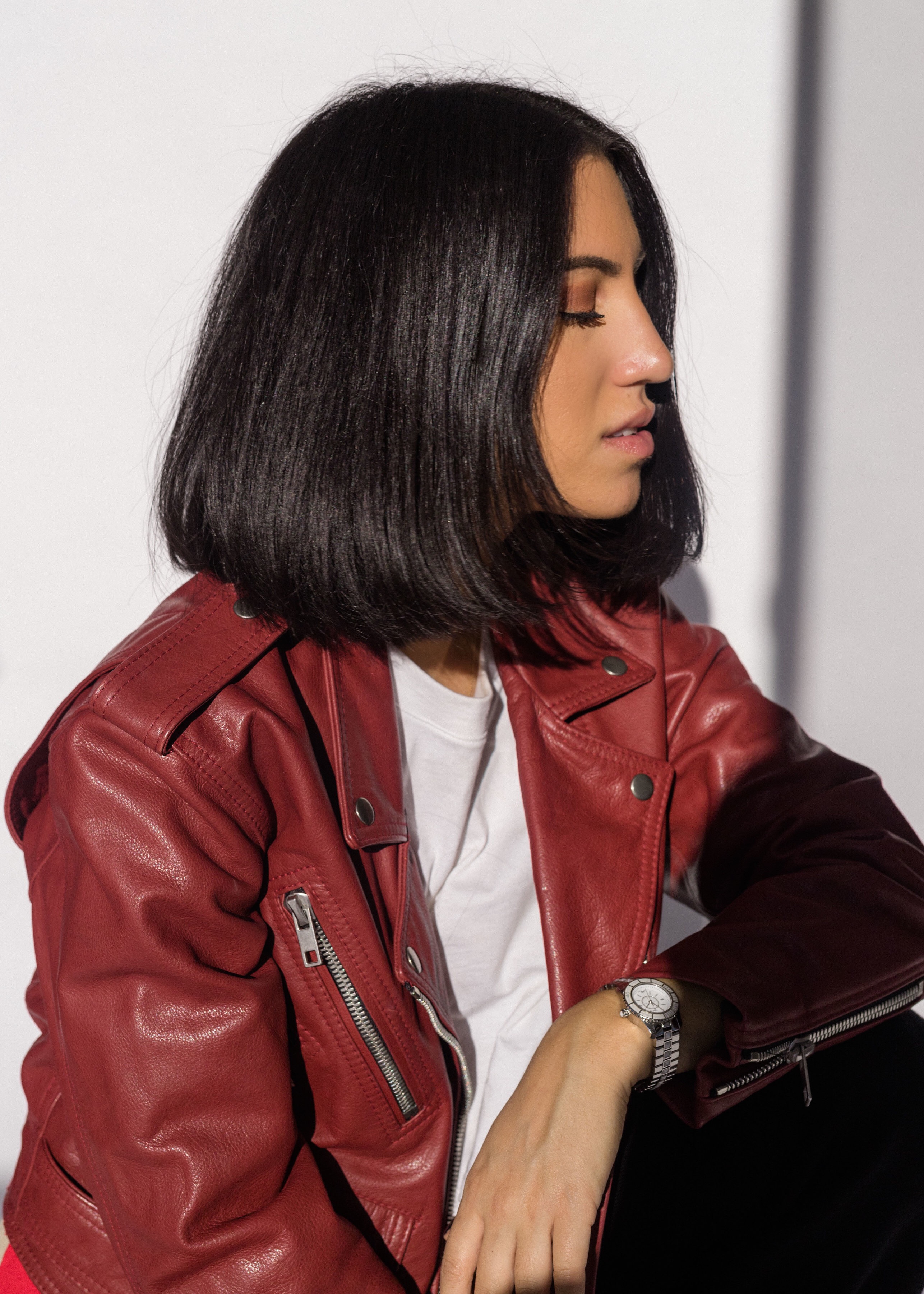 LA Blogger Tania Sarin featuring beauty brand Herbal Essences and showing off major hair goals in red leather jacket and shadow photography.